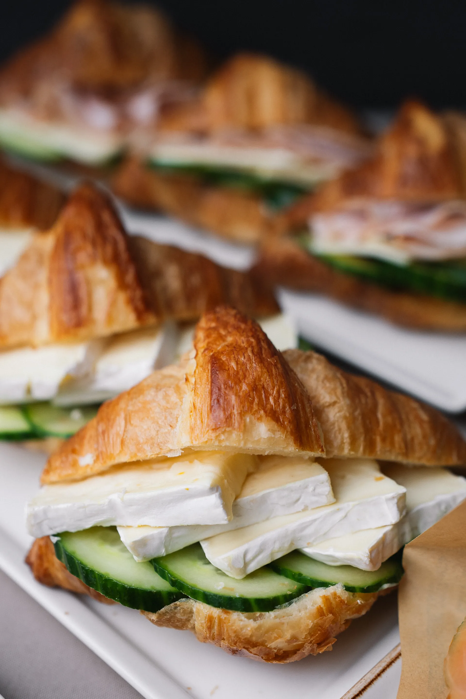 Filled croissant sandwiches on a platter
